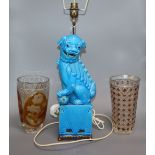 A lion-dog table lamp and two overlaid cut glass vases