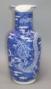 A Chinese Kangxi period blue and white 'dragon' rouleau vase height 46cm (a.f.)