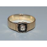 A Victorian yellow metal, diamond and black onyx? set mourning ring to W.H.W. 1851, size O.