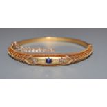 A Victorian 15ct, sapphire and diamond set hinged bangle.