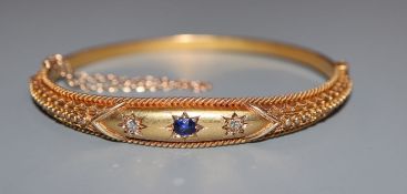 A Victorian 15ct, sapphire and diamond set hinged bangle.
