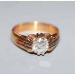 A gentleman's 18ct yellow metal and claw set solitaire diamond ring, the stone weighing