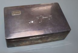 A George V silver mounted rectangular cigarette box, Birmingham, 1928, 21.6cm.