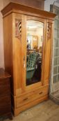 An Art Nouveau satin walnut wardrobe W.102cm