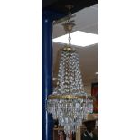 A gilt metal and cut glass bag shaped ceiling light