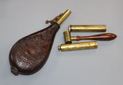 A leather powder flask and three other items