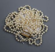 A long single strand cultured pearl necklace, with diamond set yellow metal clasp, 155cm.