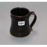 A Leach studio St Ives black glazed tankard H.12cm