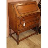 A 1920s oak bureau W.76cm