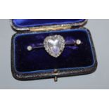 A diamond and moonstone bar brooch, heart-shaped setting in yellow metal (one stone missing),