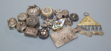 A collection of Indian white metal boxes and other items including a rattle, condiment, etc.