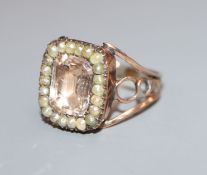 A Georgian yellow metal pink paste and seed pearl set ring, size I/J.