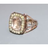 A Georgian yellow metal pink paste and seed pearl set ring, size I/J.