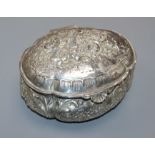 An early 20th century continental repousse silver oval trinket box, decorated with cherubs, import