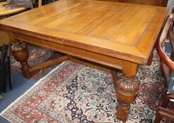 A Jacobean style oak drawleaf refectory table W.270cm (extended)