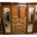 A Victorian mahogany inverse breakfront wardrobe W.216cm