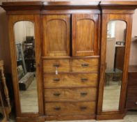 A Victorian mahogany inverse breakfront wardrobe W.216cm