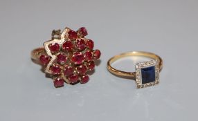 A 14k and garnet modernist cluster ring (a.f.) and an 18ct gold and platinum sapphire and diamond