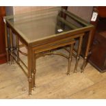 A nest of three French brass and glass tables W.56cm