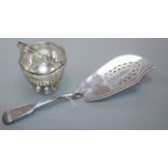 A George III silver fiddle pattern fish slice, London, 1812 and a pierced sterling small basket.