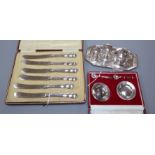 A set of six butter knives (cased), a pair of miniature patens and salt spoons (cased) and a four-