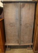 A Javanese solid teak cupboard W.95cm