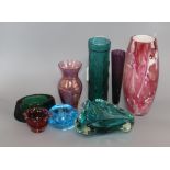 A Whitefriars style green textured cased glass vase and seven items of coloured glassware, including