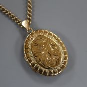 A 9ct gold engraved enclosed locket on 9ct gold chain, gross 24 grams.