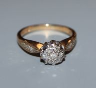 A 9ct gold diamond cluster ring, total diamond weight approximately 0.20cts, size K.