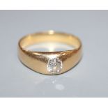 An 18ct ring gypsy-set with a single diamond, size Q/R.