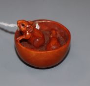 A carved wood netsuke, signed