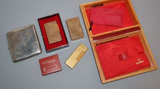 A silver cigarette case, a Dunhill lighter and two Dupont lighters