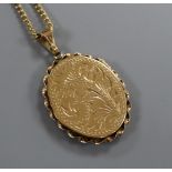 A 9ct gold engraved enclosed locket on 9ct gold chain, gross 14 grams.