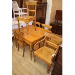 An early Victorian oak drop leaf table and six chairs W.104cm