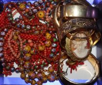 Six assorted gold plated bangles, a mounted cameo brooch and necklaces including coral.