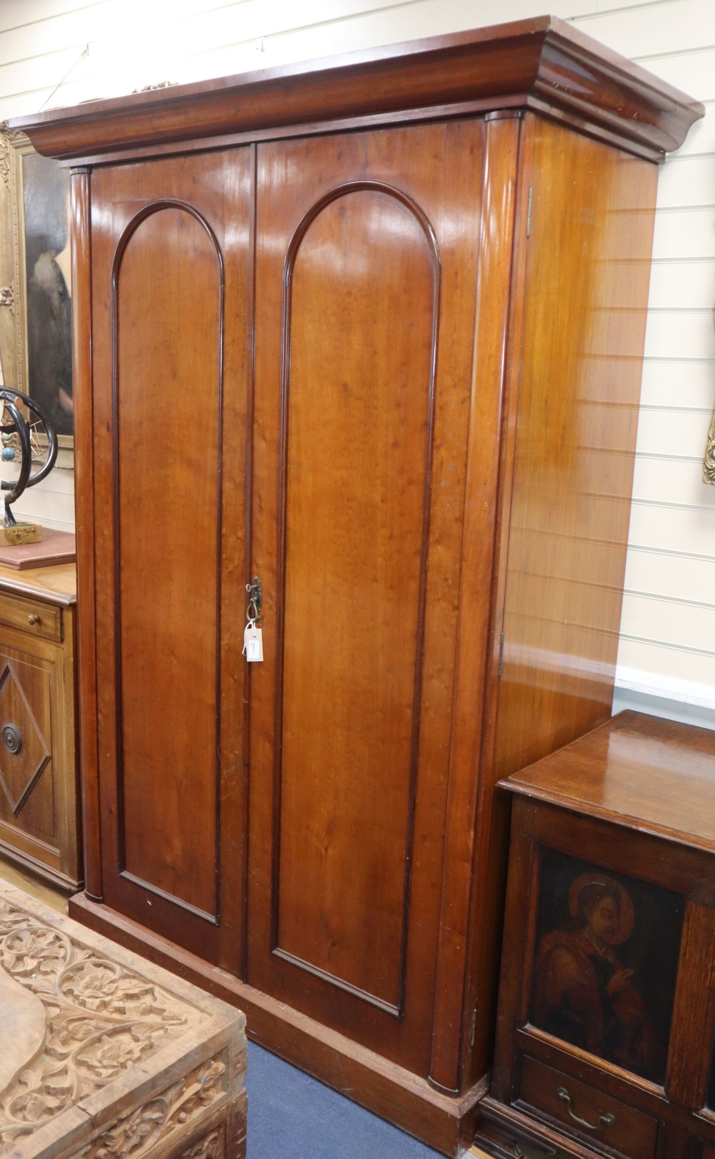 A Victorian wardrobe with interior fitments enclosed by a pair of doors W.136cm