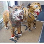 A pair of Indonesian painted terracotta figures of big cats