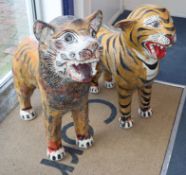 A pair of Indonesian painted terracotta figures of big cats