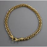 An 18ct gold curb-link bracelet with trigger clasp, 16 grams.