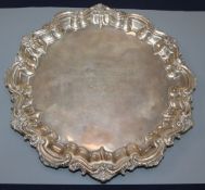 A Victorian silver waiter with shell and scroll border, Birmingham 1899, 18oz, 27.5cm.