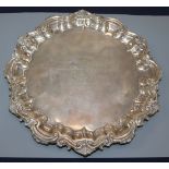 A Victorian silver waiter with shell and scroll border, Birmingham 1899, 18oz, 27.5cm.