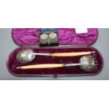 A pair of Victorian ivory handled silver salad servers by George Adams, London, 1859 and two