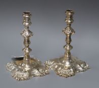 A pair of Georgian style cast silver tapersticks, London 1934, Garrard & Co (possibly