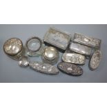 Eleven assorted Edwardian and later silver mounted glass toilet jars including Art Nouveau.