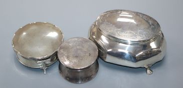 Three assorted early 20th century silver trinket boxes, including one with engraved lid, largest