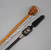 Three walking canes including a Nailsea cane and a carved wood cane