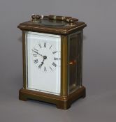 An early 20th century brass carriage timepiece