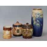 A Doulton vase, two tobacco jars and a stoneware mug tallest 25cm