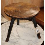 An 18th century elm primitive stool W.40cm at base