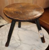 An 18th century elm primitive stool W.40cm at base